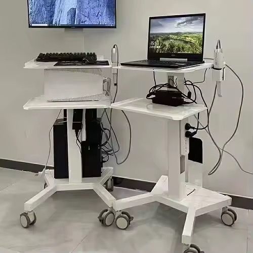 Two RIFE HA1 mobile dental workstations side by side - one with keyboard setup, one with laptop and intraoral scanner